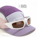 Front view of lilac, purple and pink color-block nylon cap with multi panel designed, white logo, grey piping and sunglasses slits. Urban Monkey®
