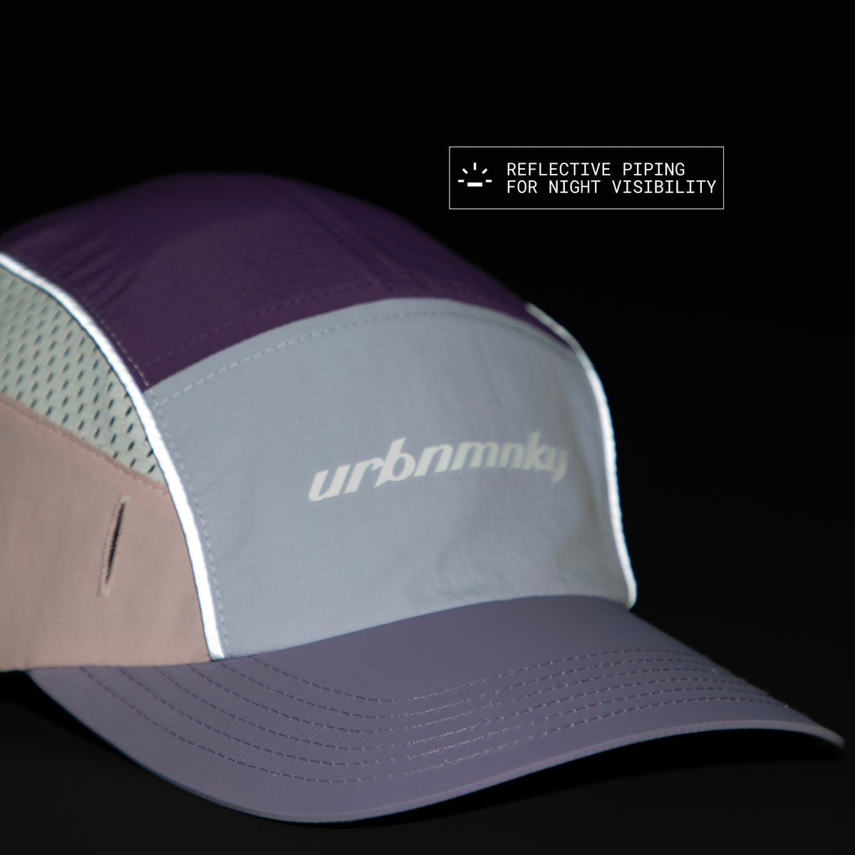 Front view of lilac, purple and pink color-block nylon cap with white logo, grey piping and radium piping for night visibility. Urban Monkey®