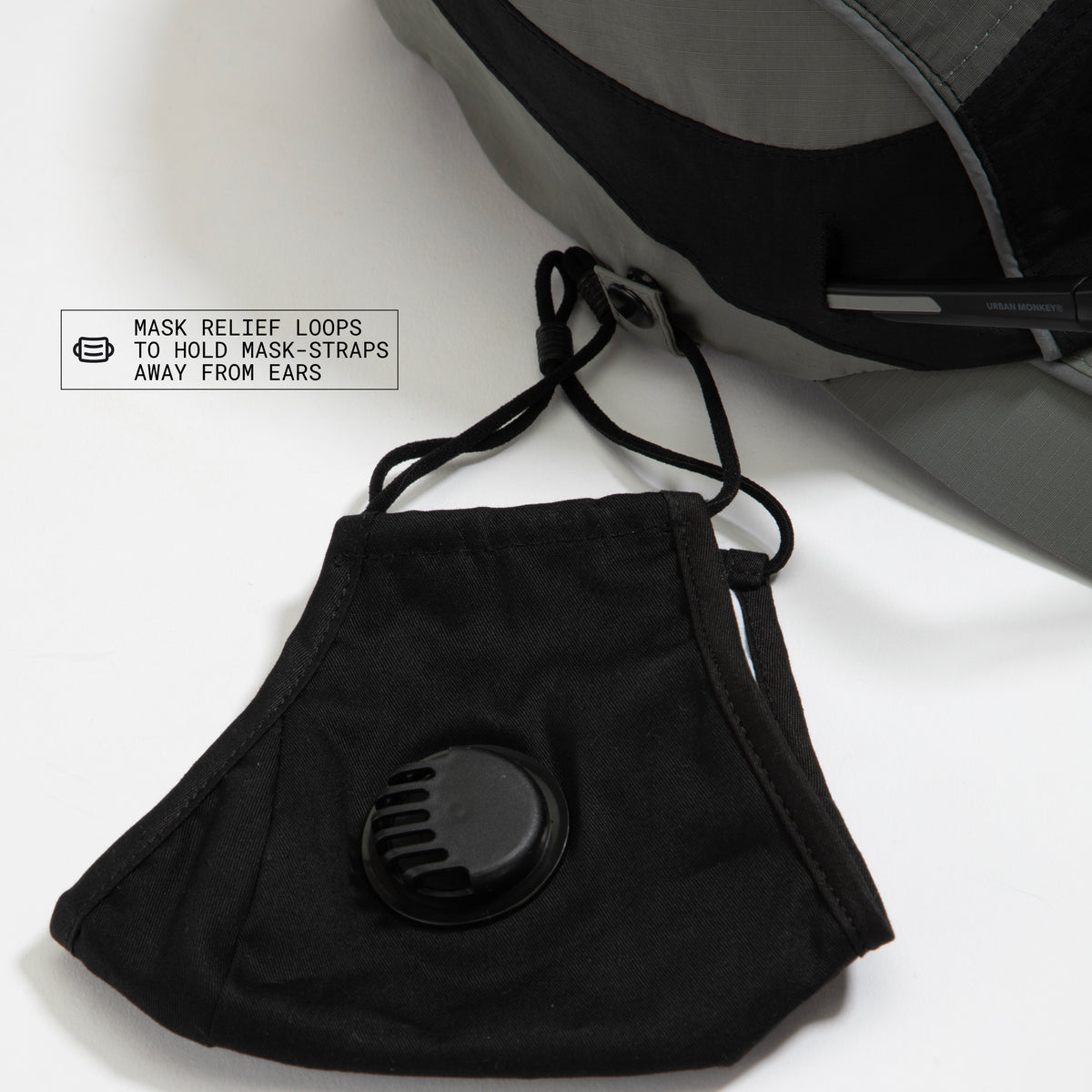 Side top view of olive-grey and black color-block nylon cap with metal side clips for mask holder. Urban Monkey®