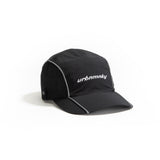 Side view of  black ripstop nylon cap with grey piping and white embroidered logo Urban Monkey®