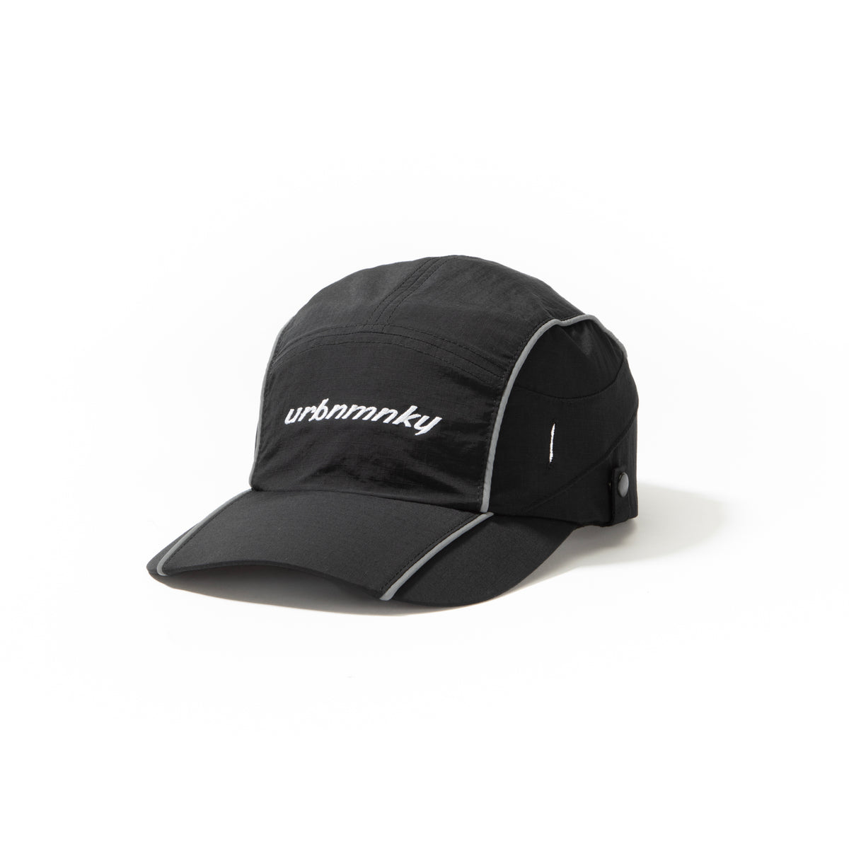 Side view of black ripstop nylon cap with grey piping and white embroidered logo Urban Monkey®