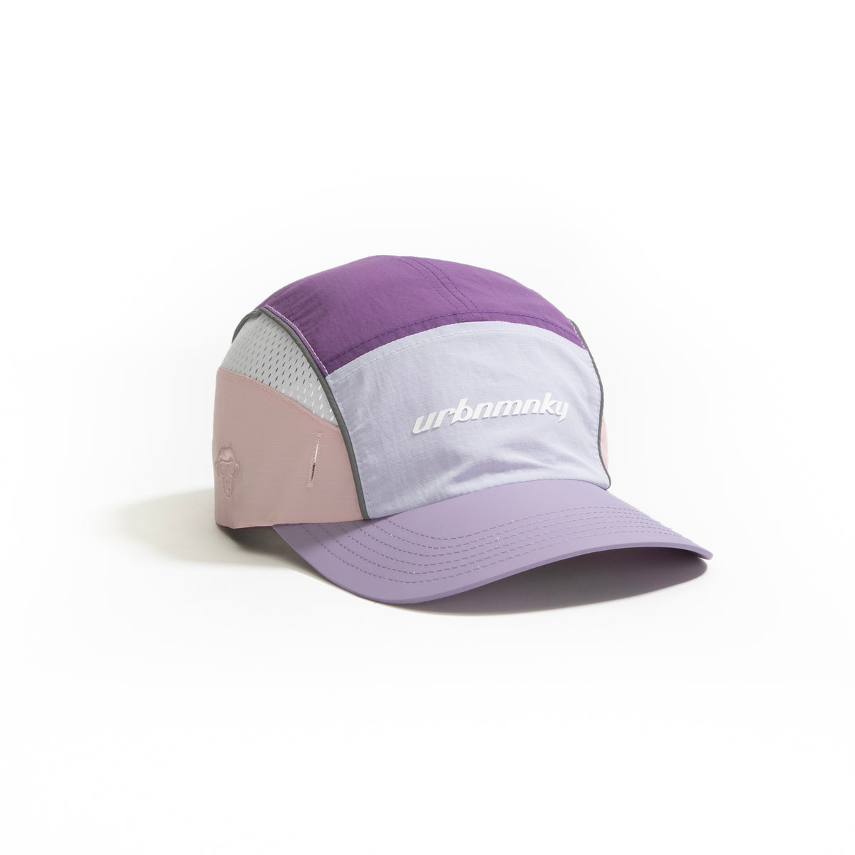 Front view of lilac, purple and pink color-block nylon cap with white logo, grey piping and sunglasses slits. Urban Monkey®