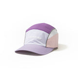 Front side view of lilac, purple and pink color-block nylon cap with white logo, grey piping and sunglasses slits. Urban Monkey®