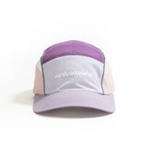 Front view of lilac, purple and pink color-block nylon cap with white logo and grey piping. Urban Monkey®
