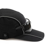 Side view of black ripstop nylon cap with grey piping, sunglasses eyelet, white embroidered logo and metal side clips Urban Monkey®