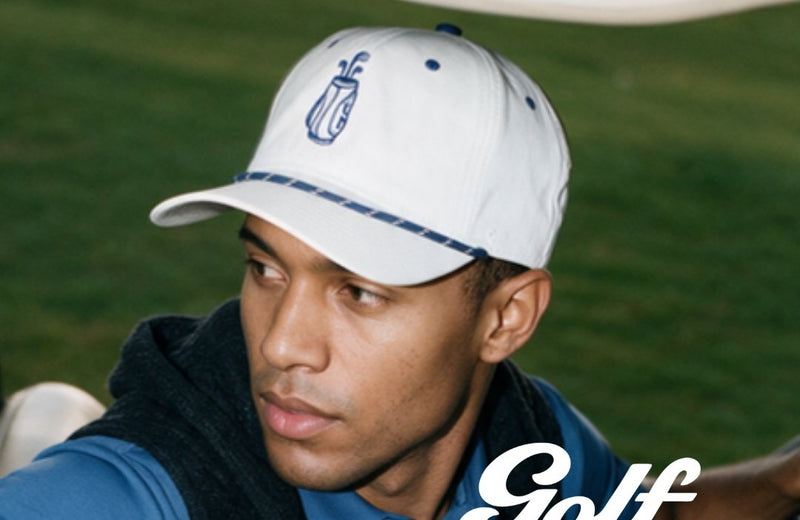 Man wearing the white 19th Hole cap
